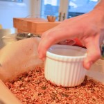 Seedy cherry quinoa bars pressing